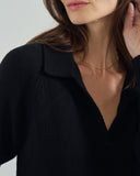 Detail shot of The Avery Cotton Polo Sweater in black — Turkish cotton