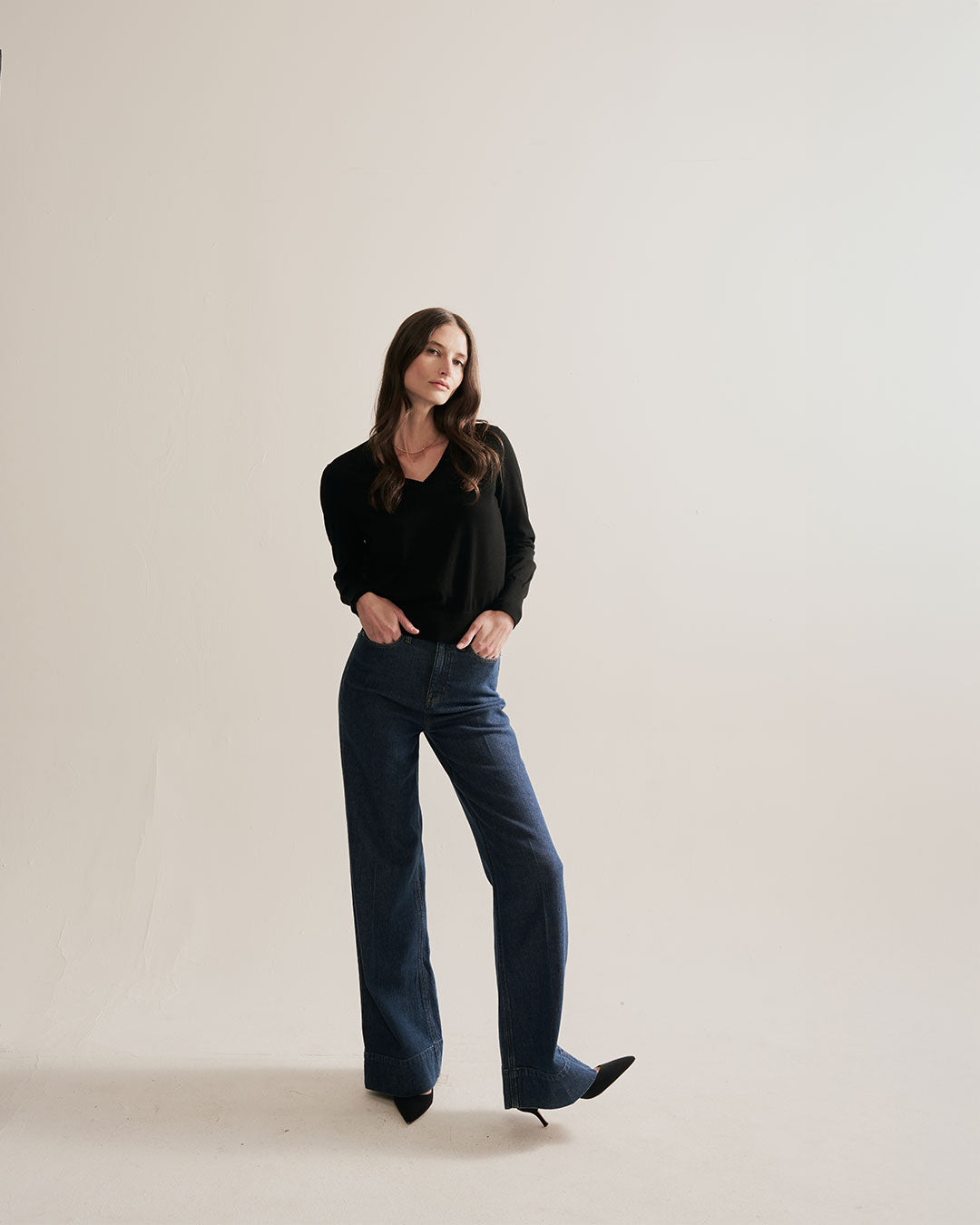 The Claremont Cotton V-Neck Sweater in black, mood shot — State of Cotton NYC