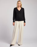 The Dorien V-Neck Cotton Sweater in black, styled view — State of Cotton NYC