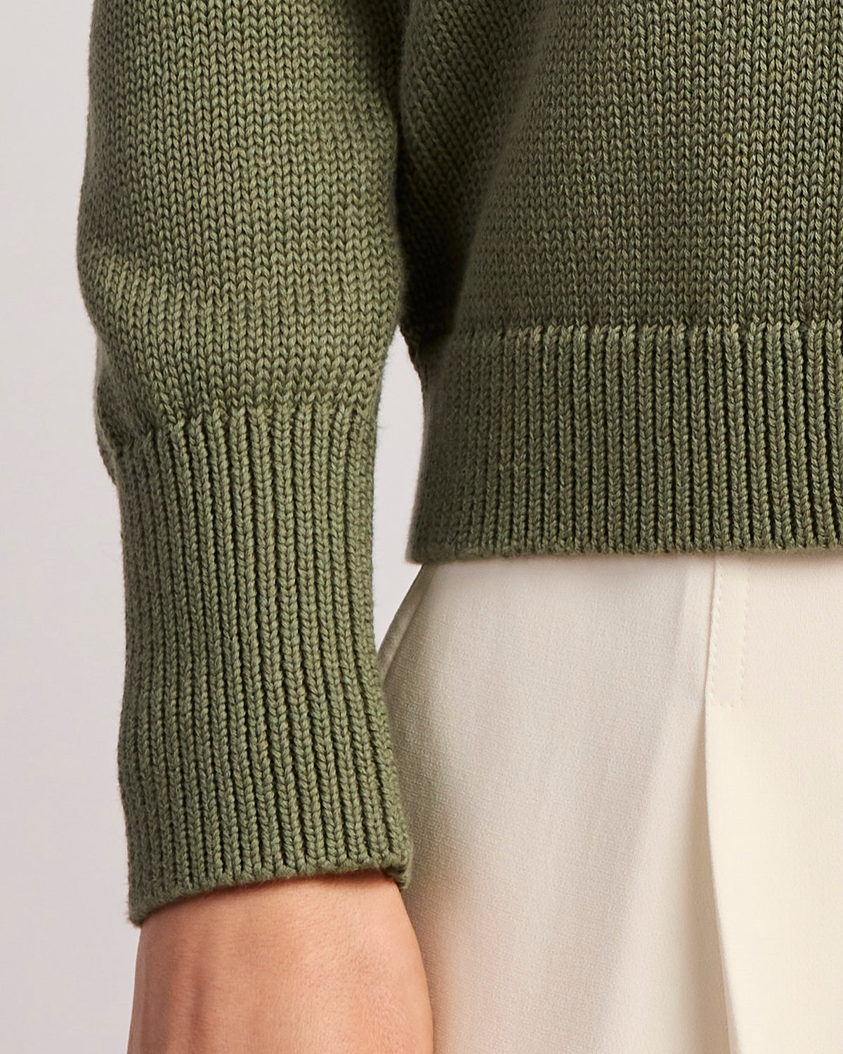 Detail shot of The Dorien V-Neck Cotton Sweater in cypress, sleeve cuff