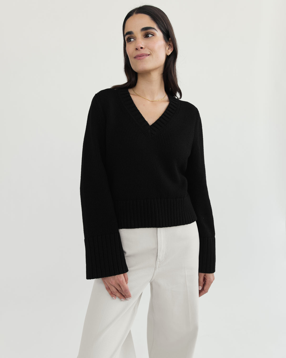 The Easton Cotton V-Neck Sweater in black, styled view — State of Cotton NYC