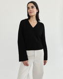 The Easton Cotton V-Neck Sweater in black, styled view — State of Cotton NYC