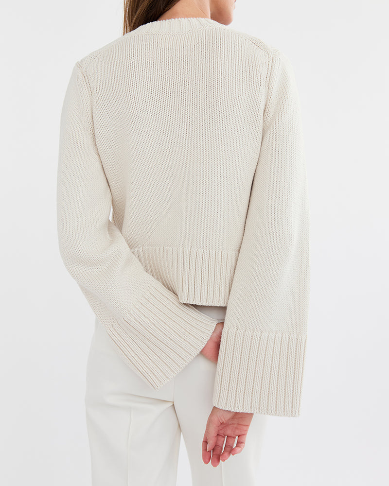 Detail shot of The Easton Cotton V-Neck Sweater in ivory — Turkish cotton, Italian-spun