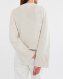 Detail shot of The Easton Cotton V-Neck Sweater in ivory — Turkish cotton, Italian-spun