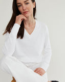 Woman wearing The Ellie Cotton V-Neck Sweater in white — State of Cotton NYC