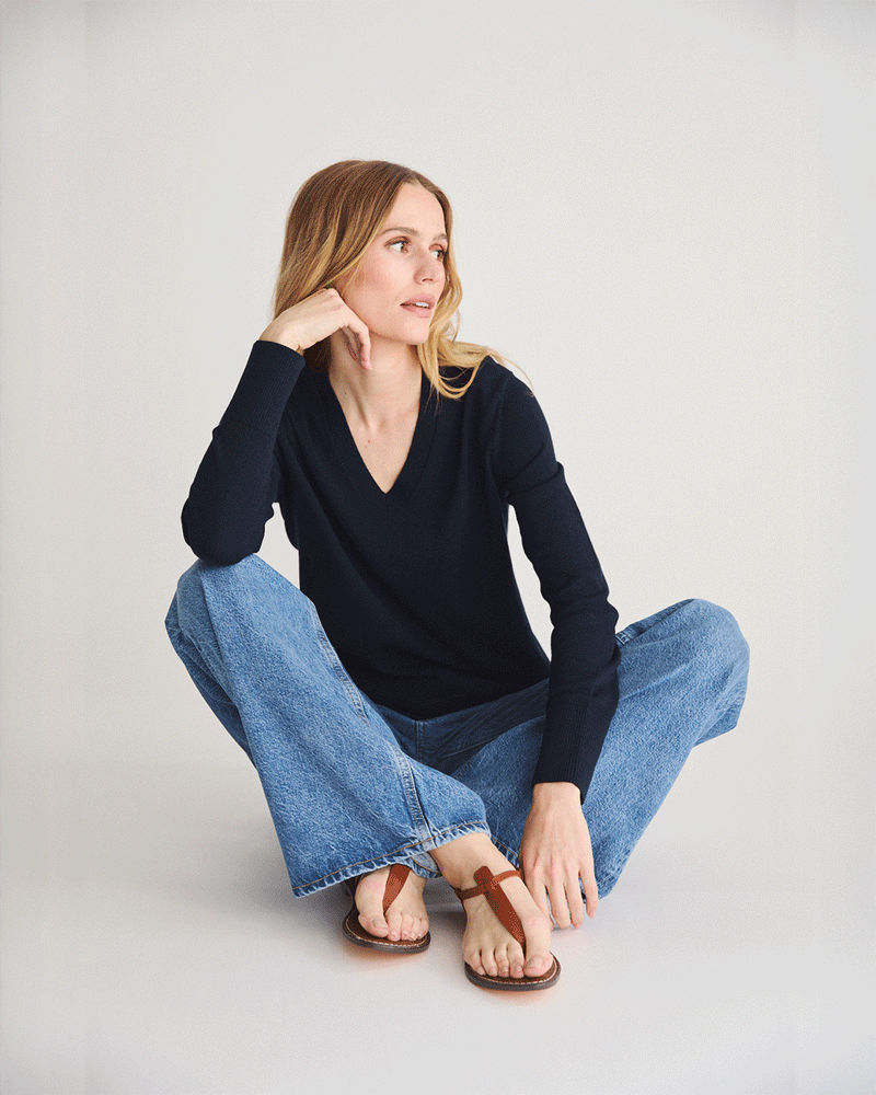 Detail shot of The Ellie Cotton V-Neck Sweater in navy — Egyptian cotton, Italian-spun