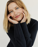 Woman wearing The Ellis Cotton Cardigan in navy — State of Cotton NYC