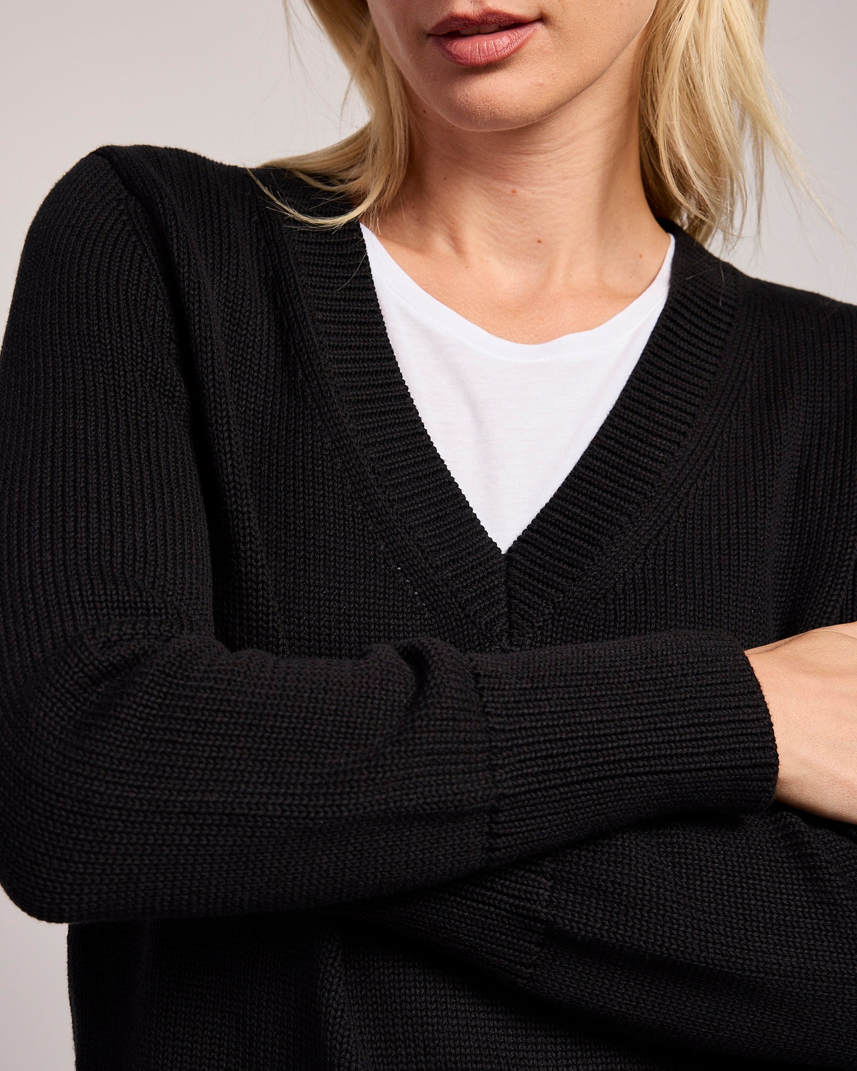 The Dorien V-Neck Cotton Sweater in black, styled view — State of Cotton NYC