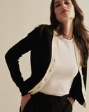 Detail shot of The Perry Tipped Cotton Cardigan in black — Egyptian cotton, Italian-spun