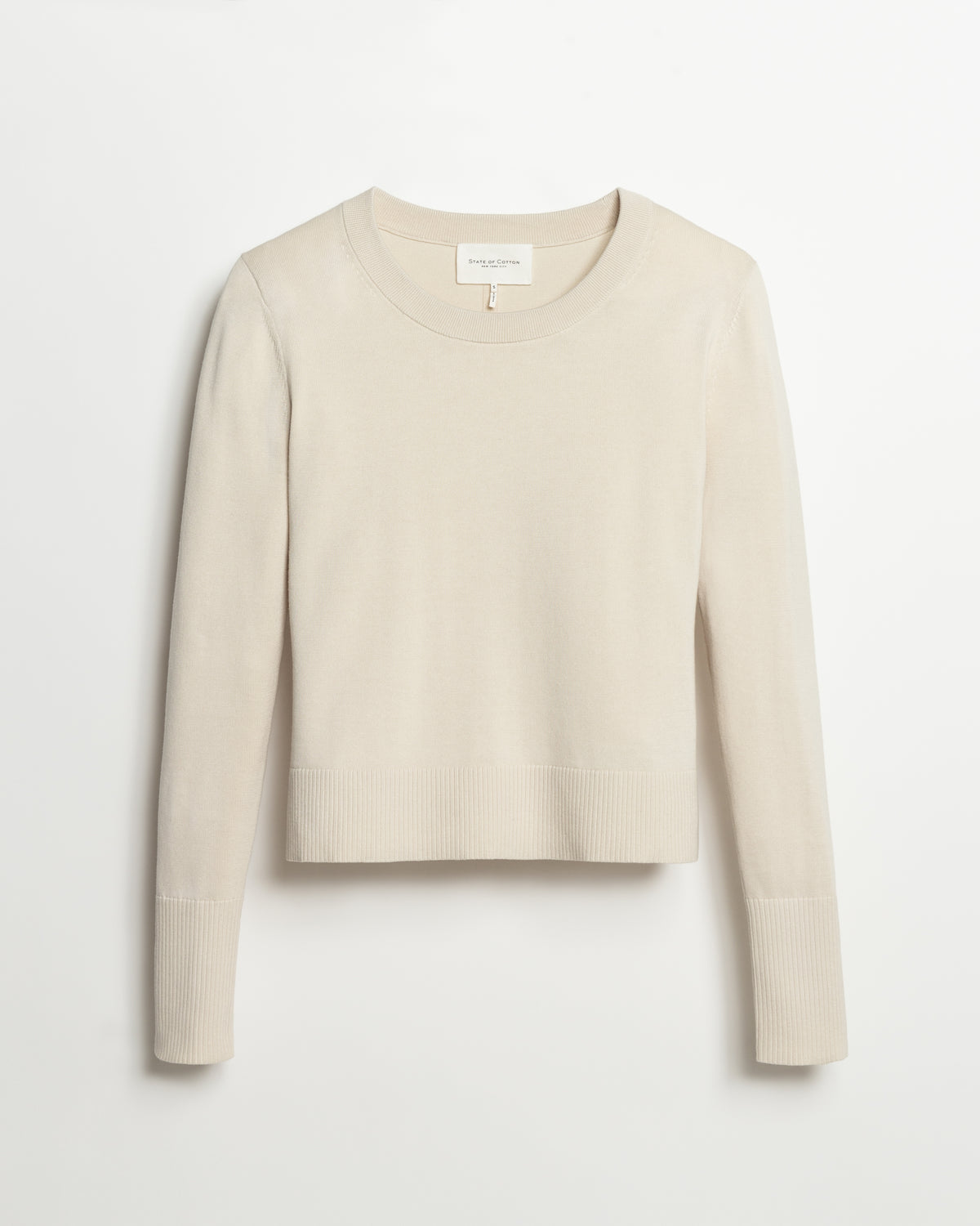 The Sinclair Cotton Crewneck Sweater in ivory, styled view — State of Cotton NYC