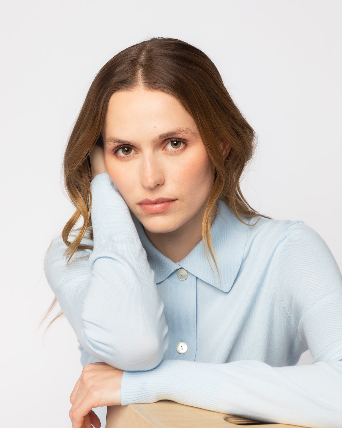 The Halsey Cotton Polo Sweater in pale blue, lifestyle view — State of Cotton NYC
