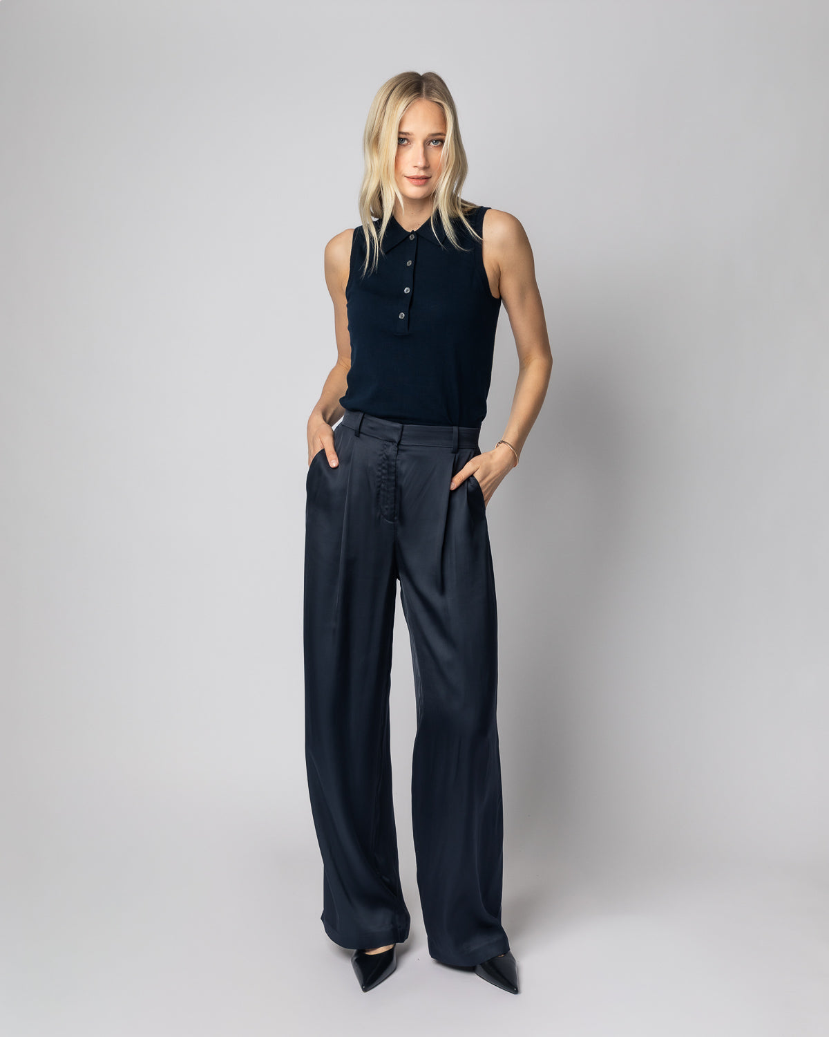 Woman wearing The Ainsley Sleeveless Cotton Polo in navy — State of Cotton NYC