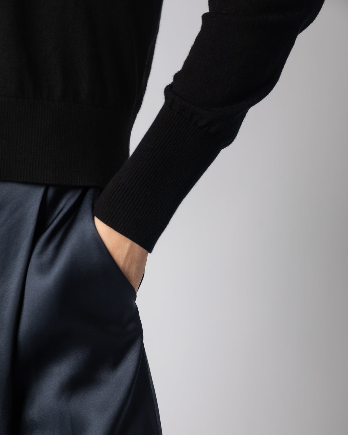 Detail shot of The Claremont Cotton V-Neck Sweater in black — superfine Egyptian cotton