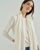 Woman wearing The Tilly Superfine Cotton Wrap in cream, styled view — State of Cotton NYC