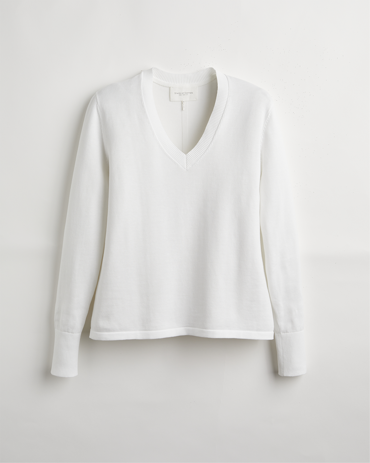 The Ellie Cotton V-Neck Sweater in white, front view — State of Cotton NYC