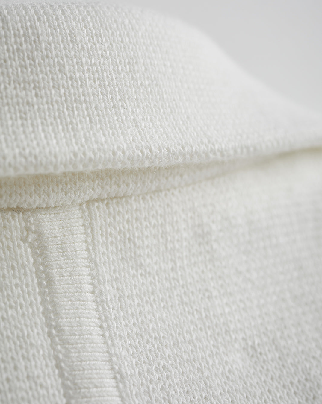 Detail shot of The Beale Cotton Cardigan Blazer in ivory — organic American cotton