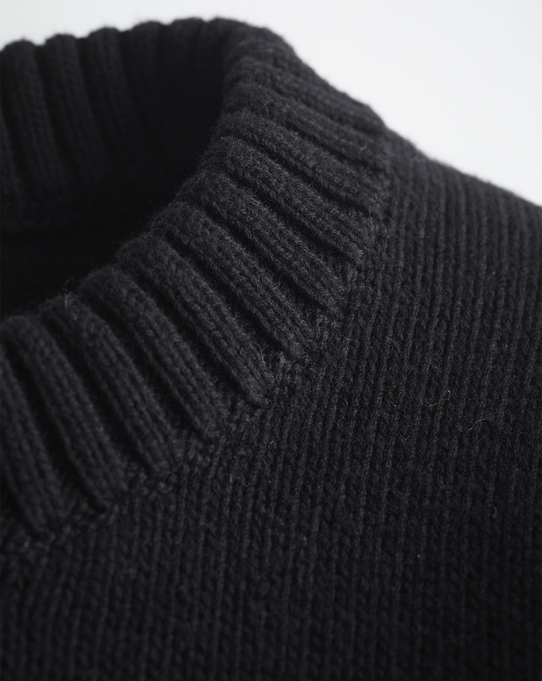 Detail shot of The Castine Cotton Crewneck Sweater in black — Turkish cotton, Italian-spun