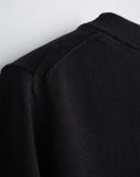 Detail shot of The Devon Cotton Crewneck Sweater in black — lightweight Egyptian cotton