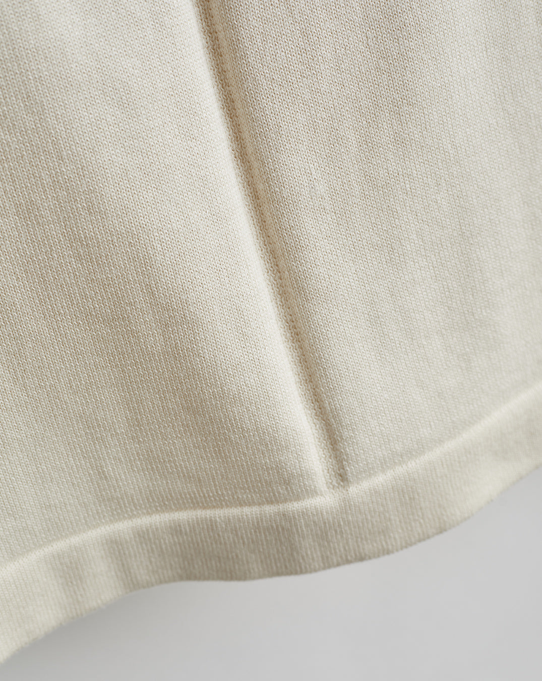 Detail shot of The Devon Cotton Crewneck Sweater in ivory — Egyptian cotton, Italian-spun