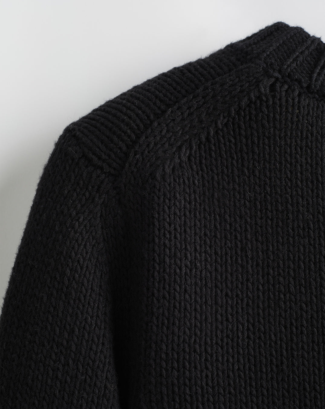 Detail shot of The Kittery Cotton Bell Sleeve Sweater in black — Italian-spun Turkish cotton
