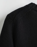 Detail shot of The Kittery Cotton Bell Sleeve Sweater in black — Italian-spun Turkish cotton