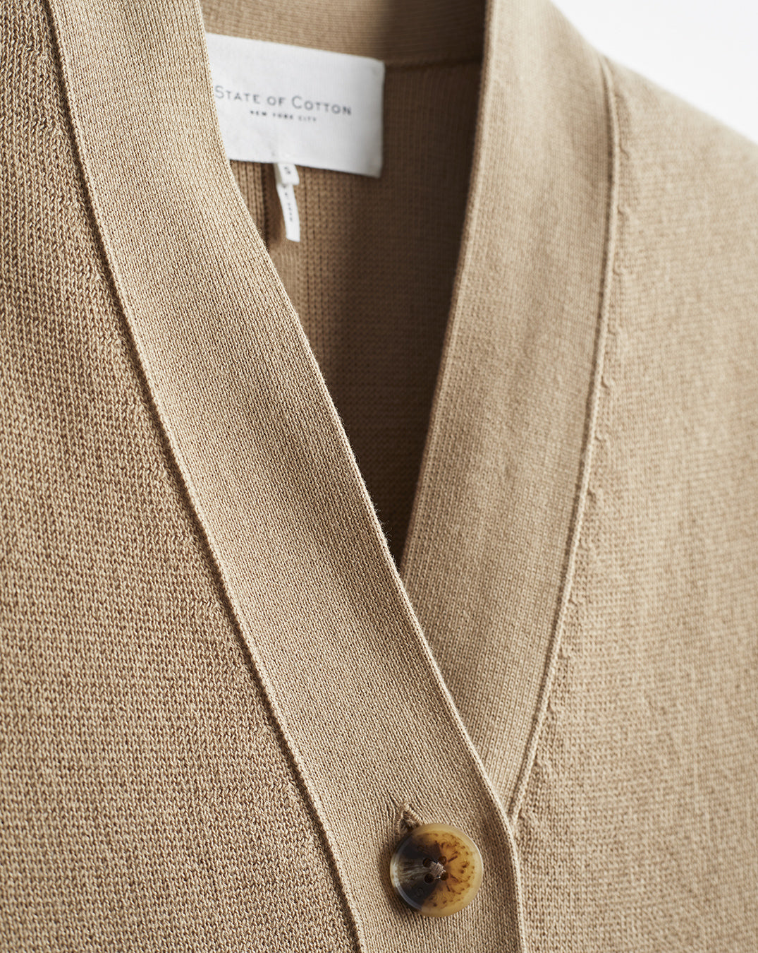 Detail shot of The Perry Cotton Cardigan in camel — Egyptian cotton