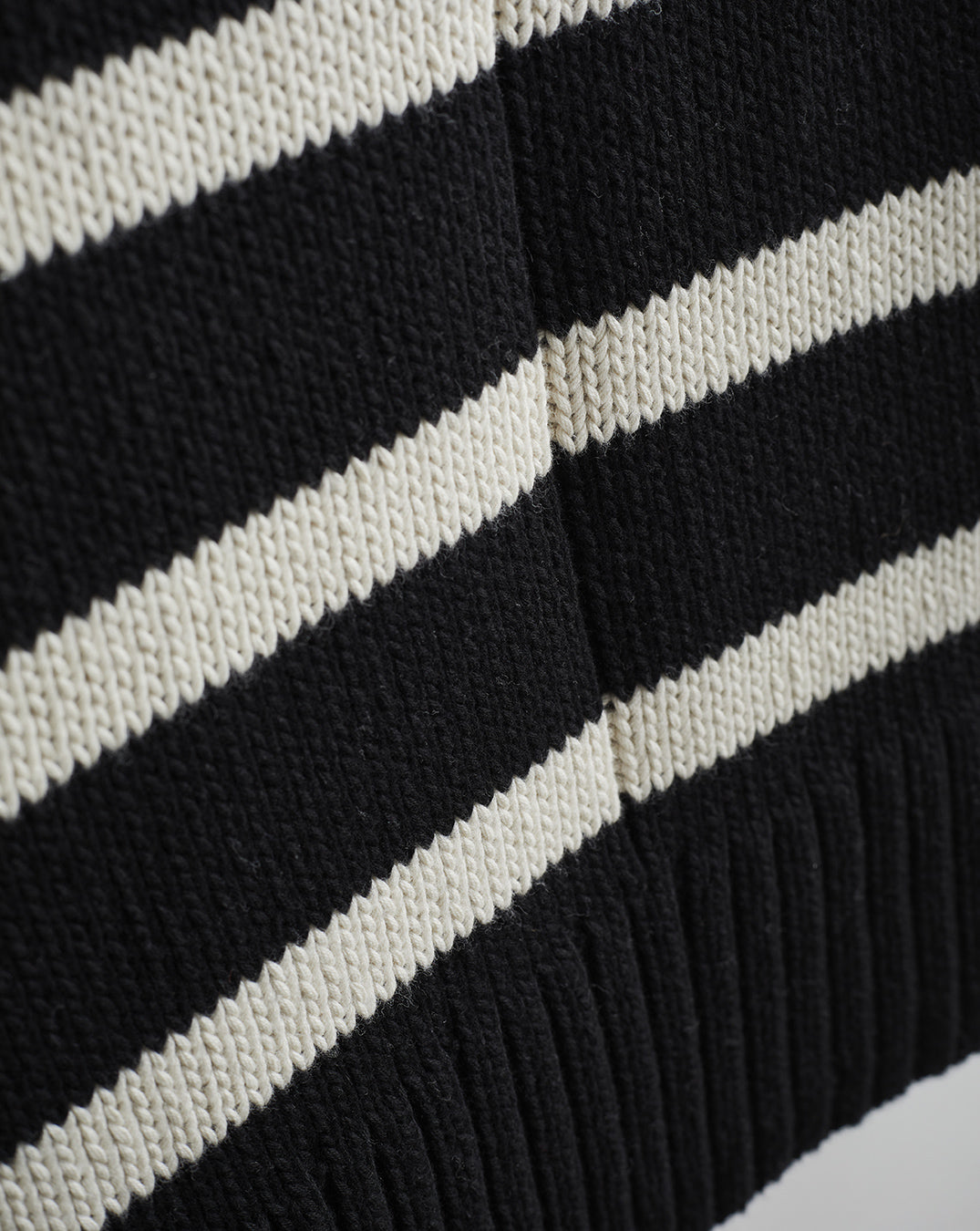 Detail shot of The Wynn Stripe Cotton Turtleneck Sweater in ivory and black — Turkish cotton