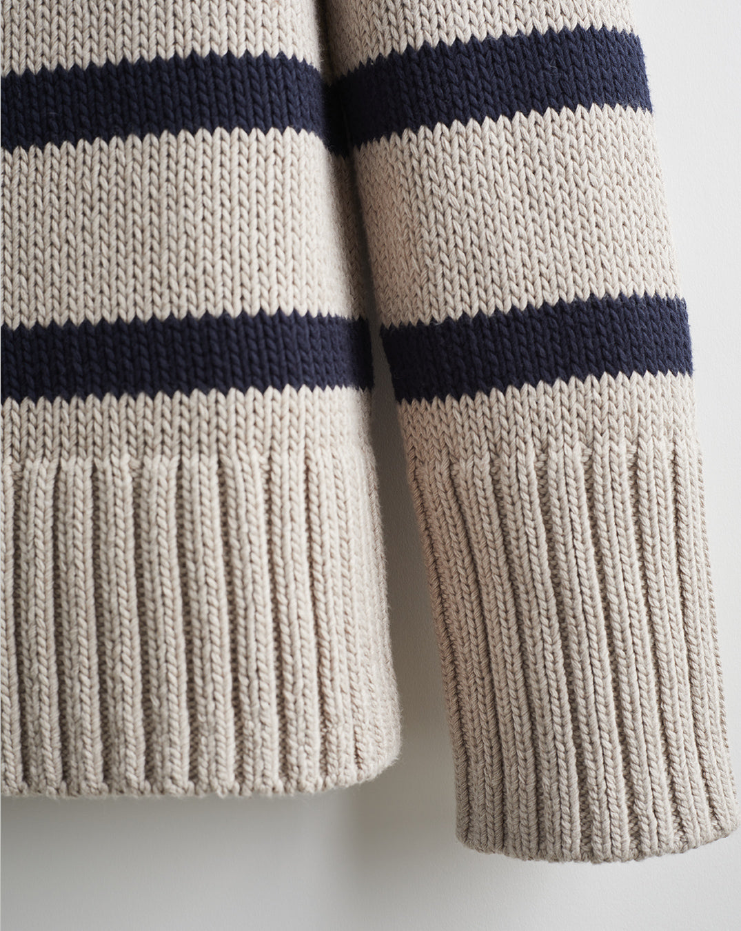Detail shot of The Wynn Stripe Cotton Turtleneck Sweater in oat and navy — Turkish cotton