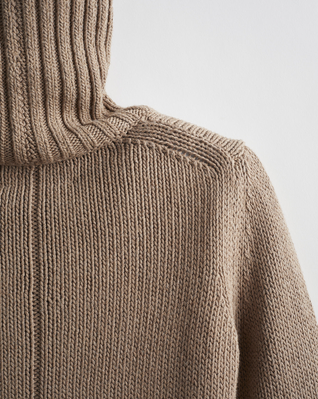 Detail shot of The Wynn Cotton Turtleneck Sweater in camel — Turkish cotton