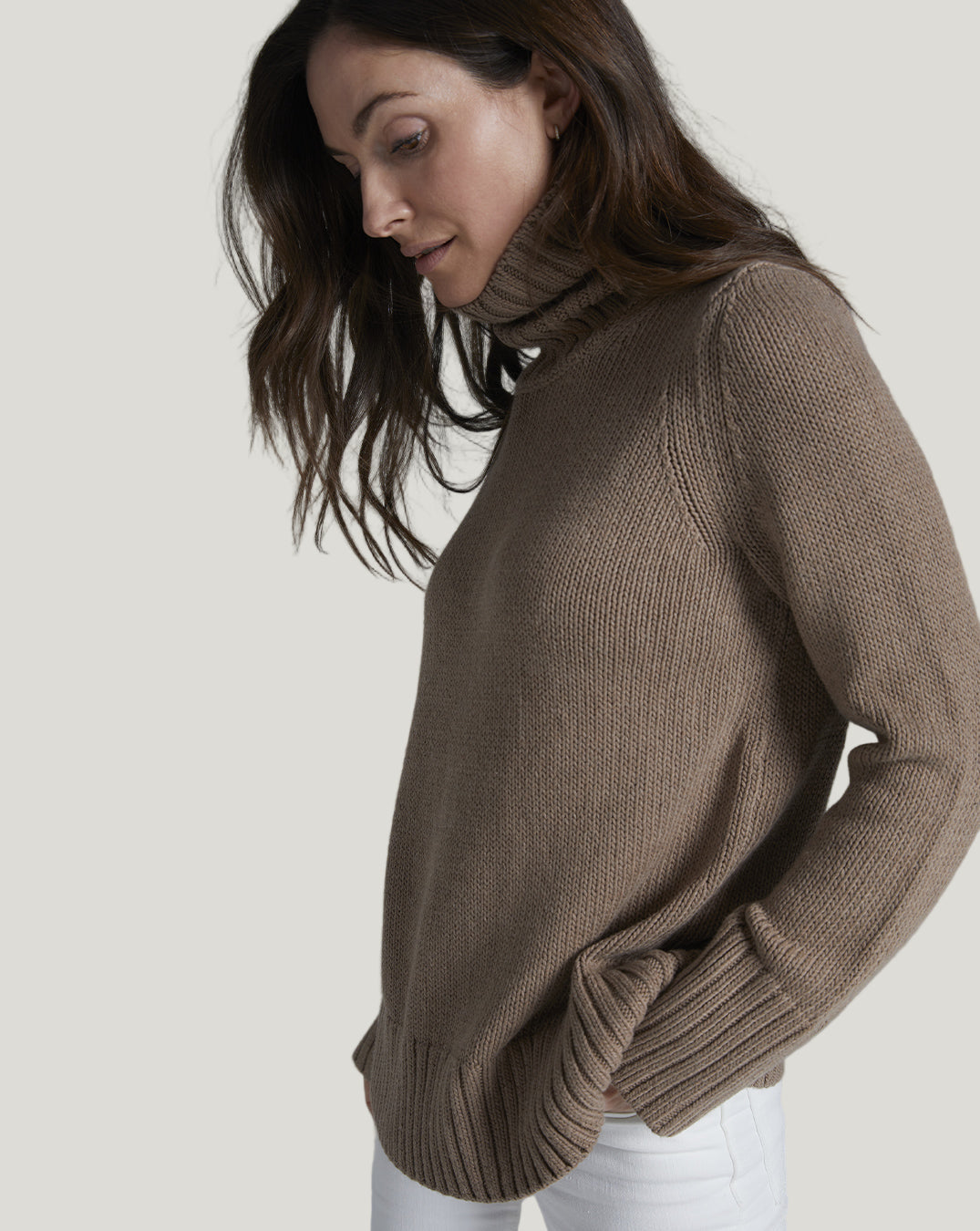 Woman wearing The Wynn Cotton Turtleneck Sweater in camel — Italian-spun Turkish cotton — State of Cotton NYC