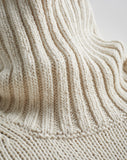 Detail shot of The Wynn Cotton Turtleneck Sweater in ivory — Turkish cotton